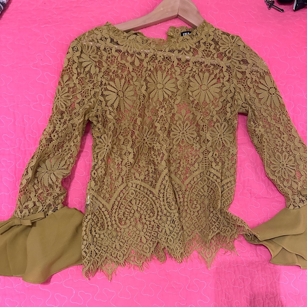 Gold lace blouse with bows on cuffs